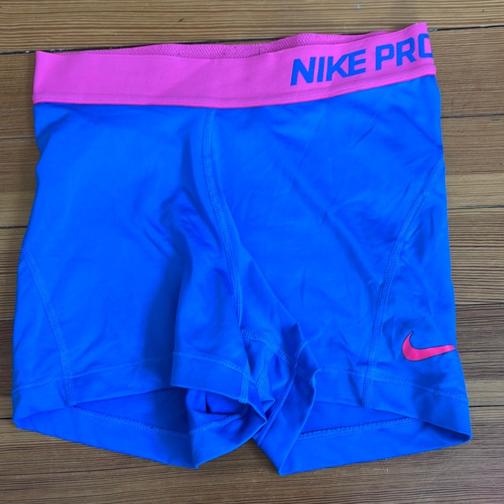 Pink and blue nike pros